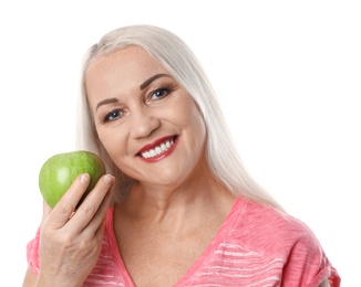 Smiling woman with perfect teeth and green apple on white background