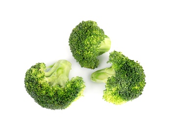 Photo of Fresh green broccoli on white background, top view. Organic food