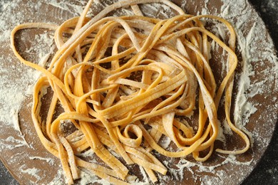 Photo of Uncooked homemade pasta on table, top view
