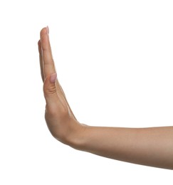 Photo of Woman showing stop gesture on white background, closeup