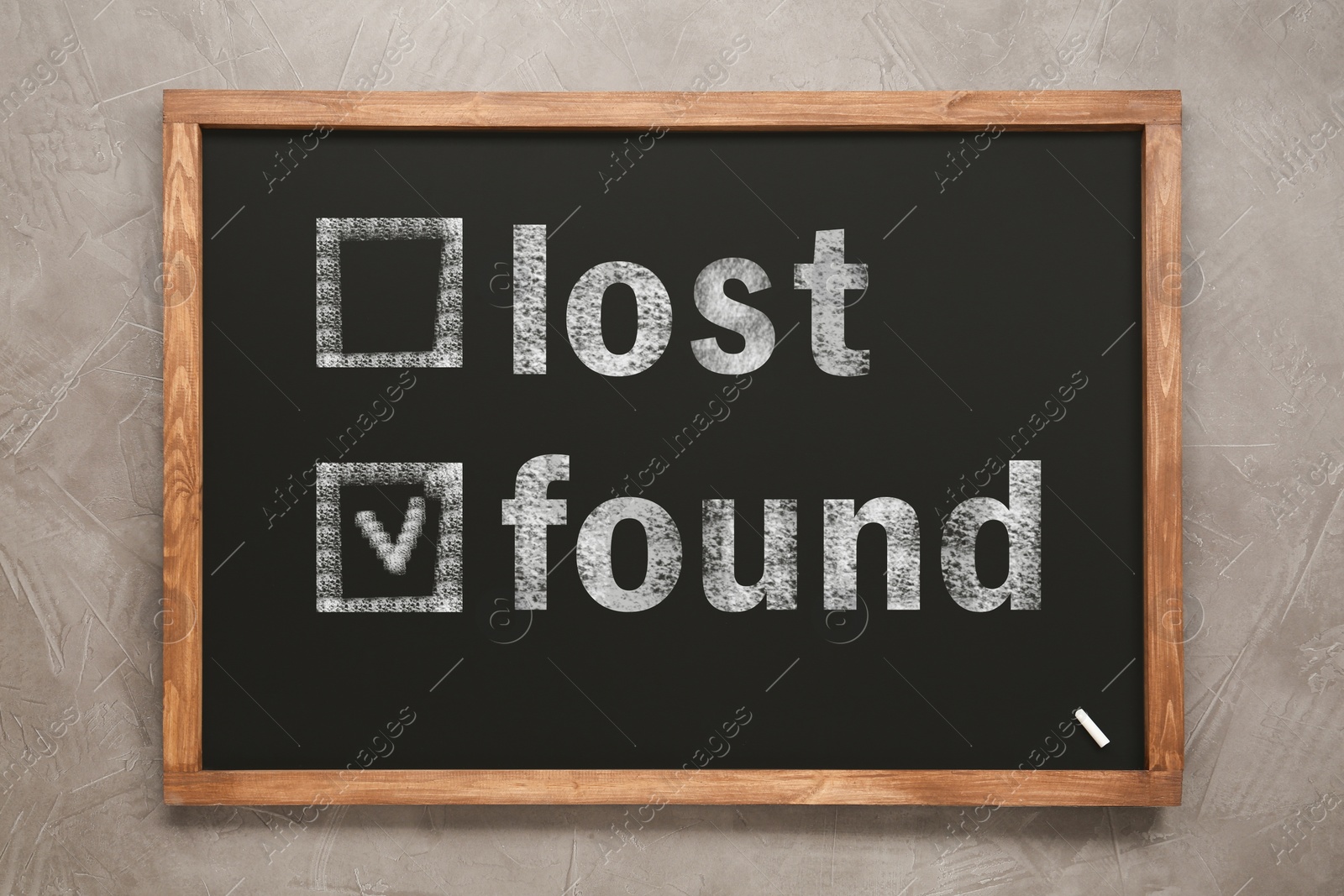 Image of Words Lost and Found written on blackboard on grey background, top view