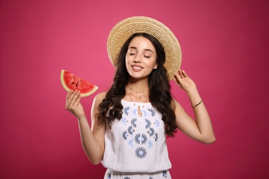 Photo of Beautiful young woman with watermelon on pink background