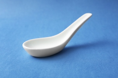 Clean Miso soup spoon on blue background