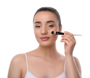 Woman with makeup brush on white background