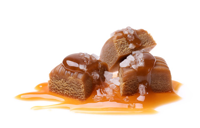 Delicious salted caramel with sauce on white background