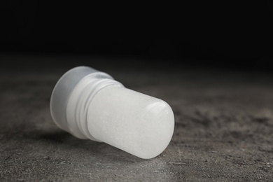 Photo of Natural crystal alum deodorant on grey table