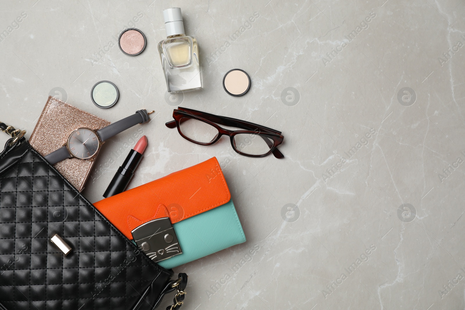 Photo of Flat lay composition with stylish bag, wallet and accessories on light background