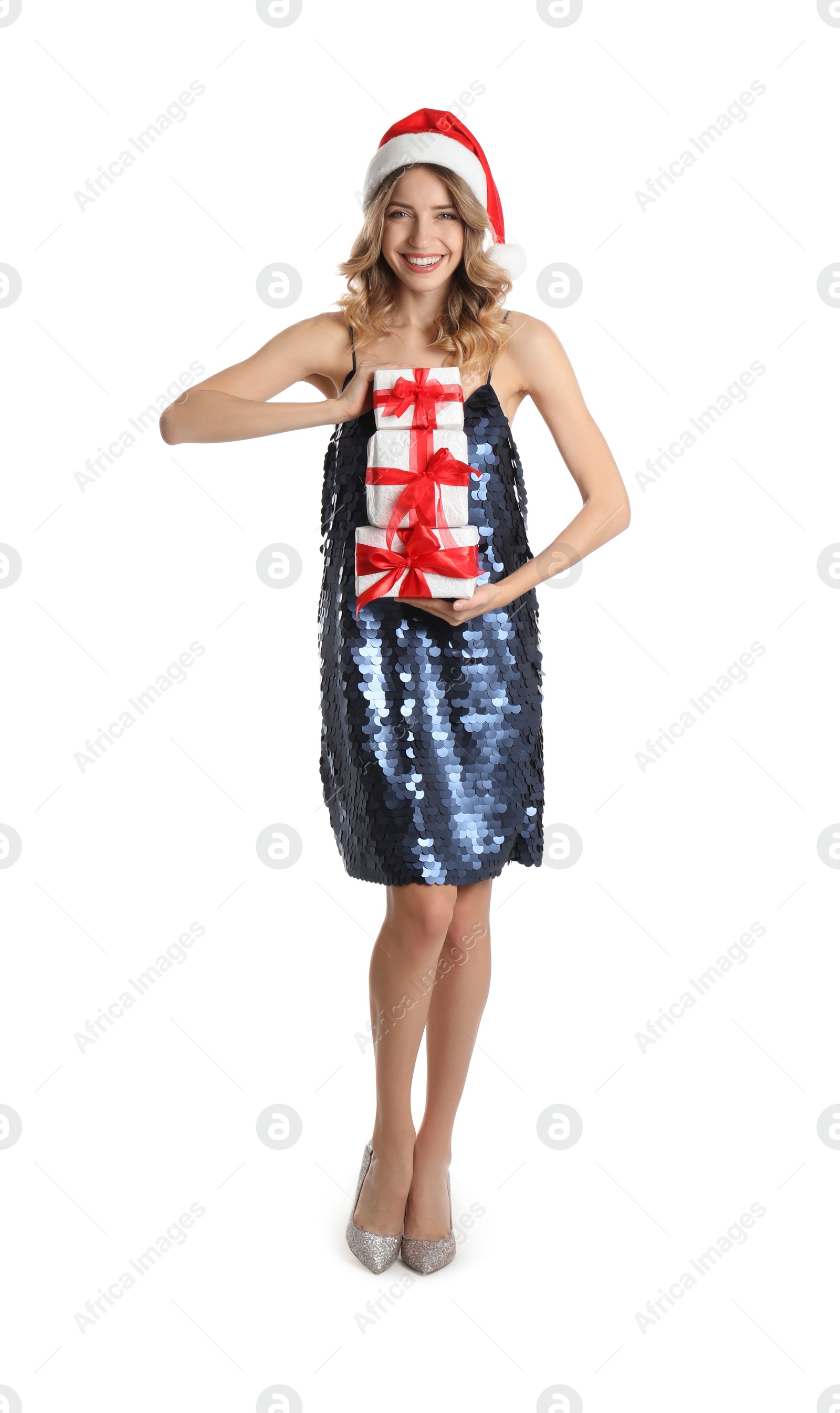 Photo of Beautiful young woman in Santa hat with Christmas presents on white background