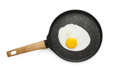 Photo of Tasty cooked chicken egg in frying pan isolated on white, top view