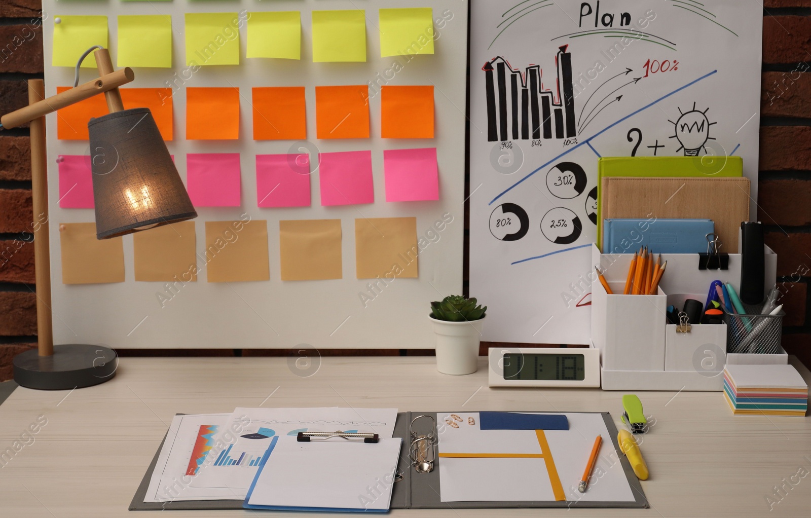 Photo of Business process planning and optimization. Workplace with colorful paper notes and other stationery on table