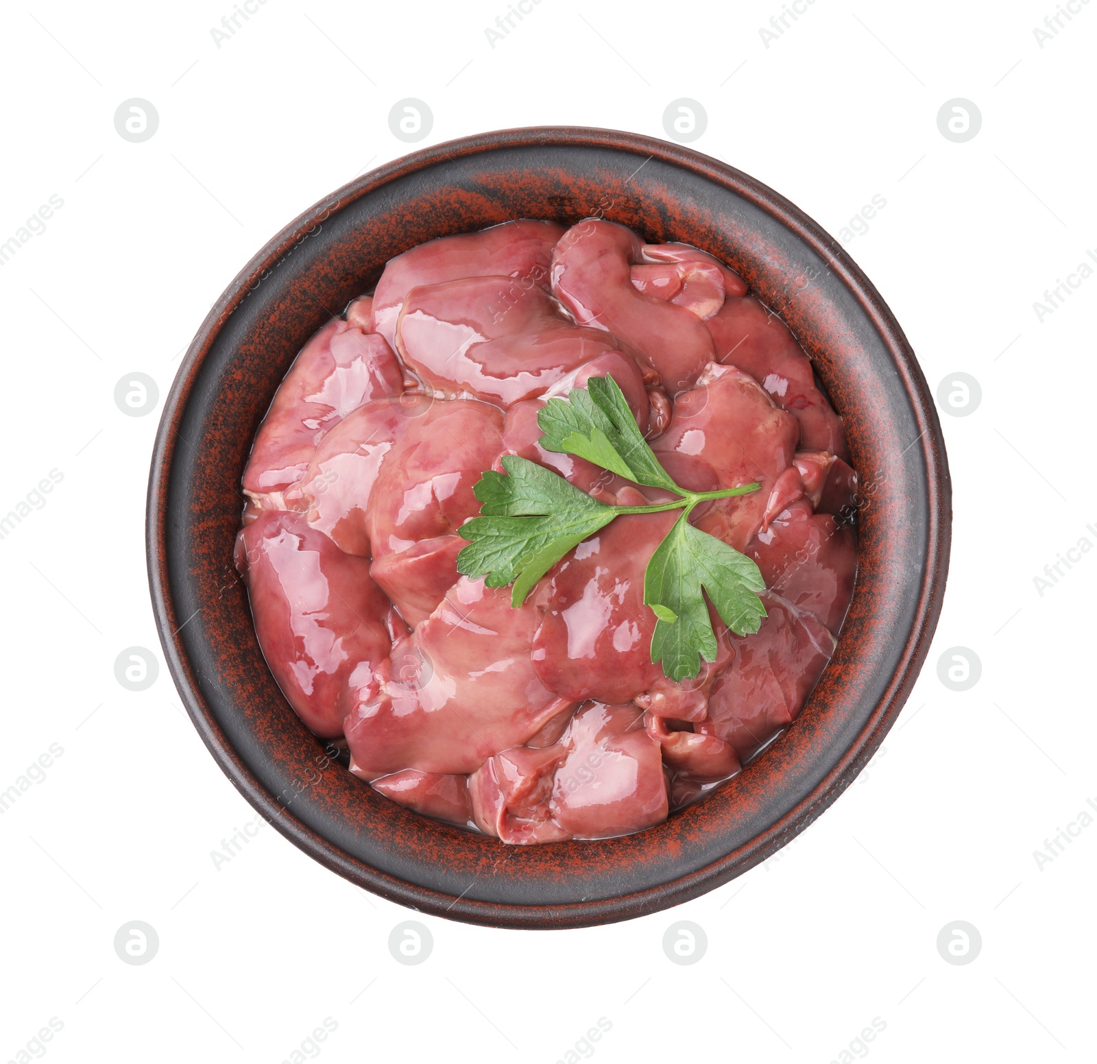 Photo of Bowl with raw chicken liver and parsley isolated on white, top view