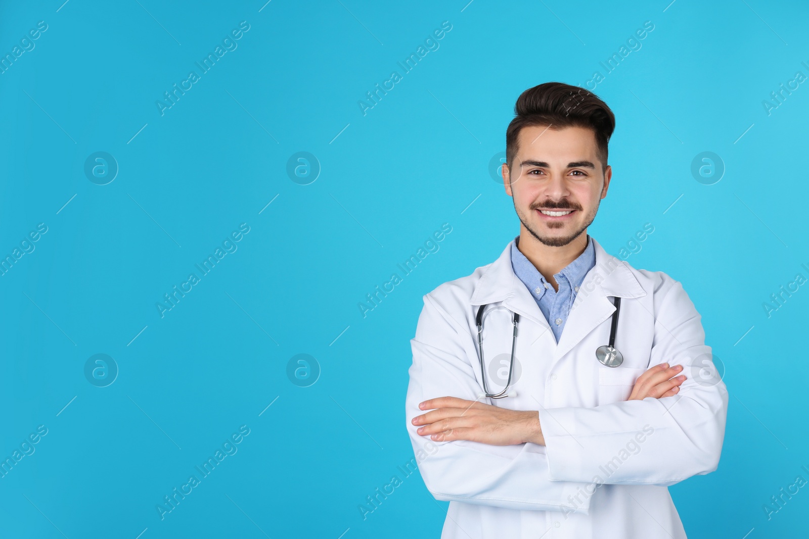 Photo of Young medical student on color background. Space for text