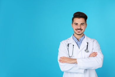 Young medical student on color background. Space for text