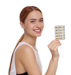 Photo of Happy young woman with pills on white background. Weight loss