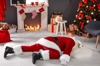 Photo of Authentic Santa Claus lying on floor indoors