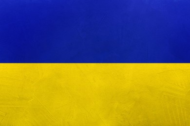 Image of National flag of Ukraine painted on textured surface