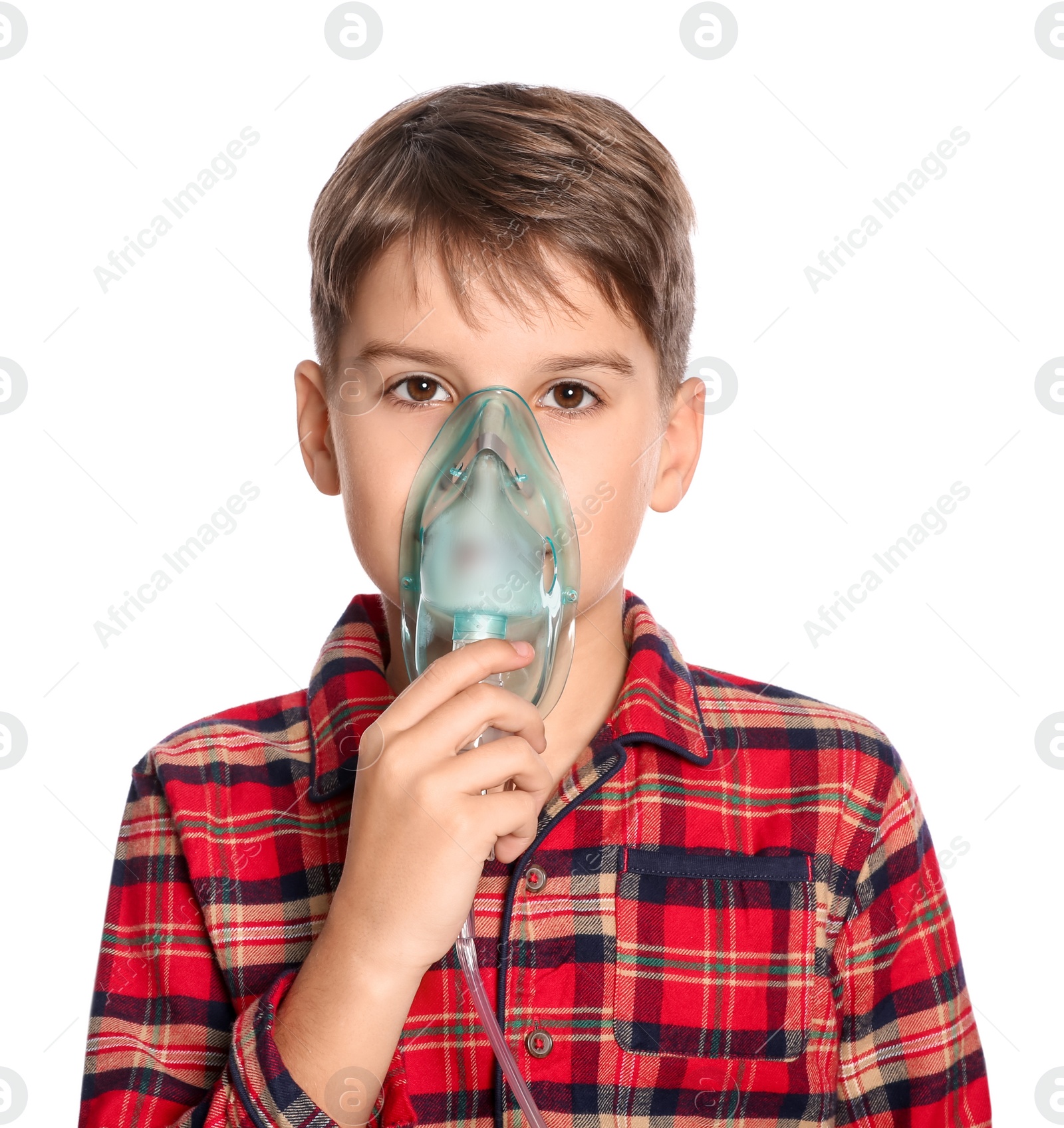 Photo of Boy using nebulizer for inhalation on white background