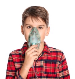 Photo of Boy using nebulizer for inhalation on white background