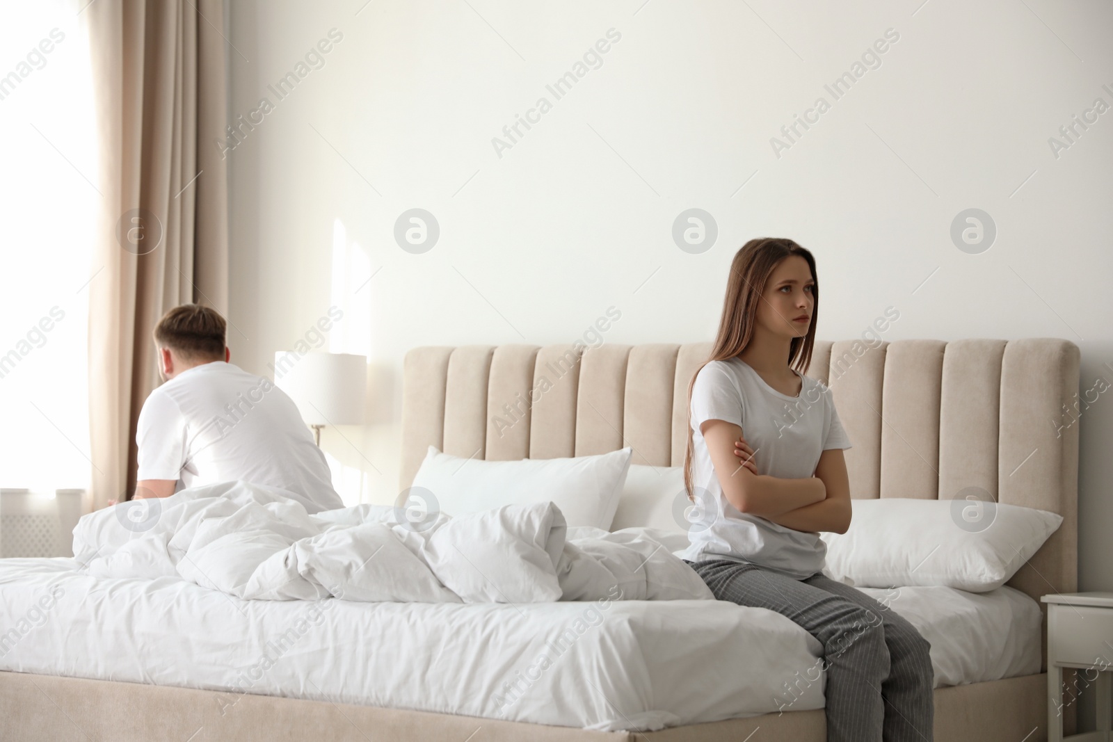 Photo of Unhappy couple with problems in relationship at home