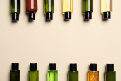 Bottles with cosmetic products, flat lay. Space for text