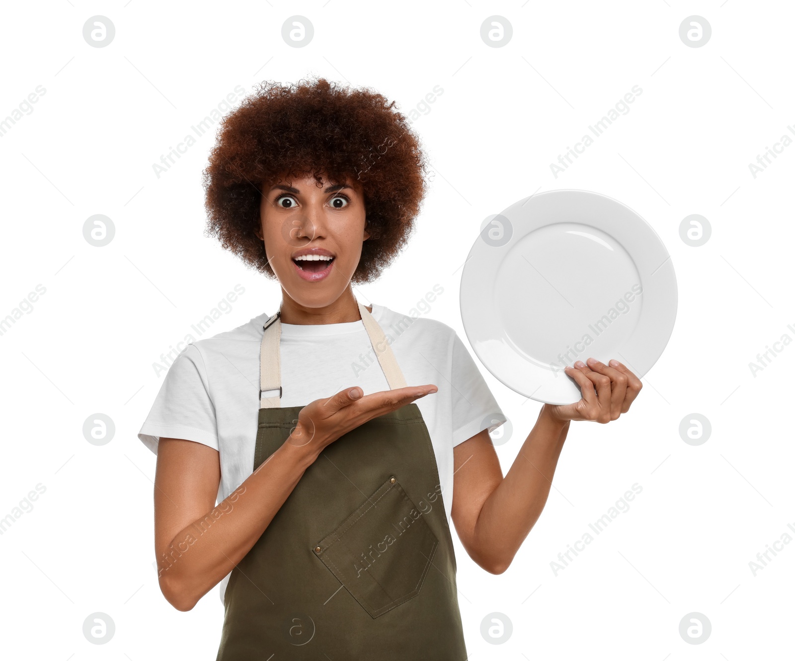 Photo of Emotional young woman in apron holding plate on white background