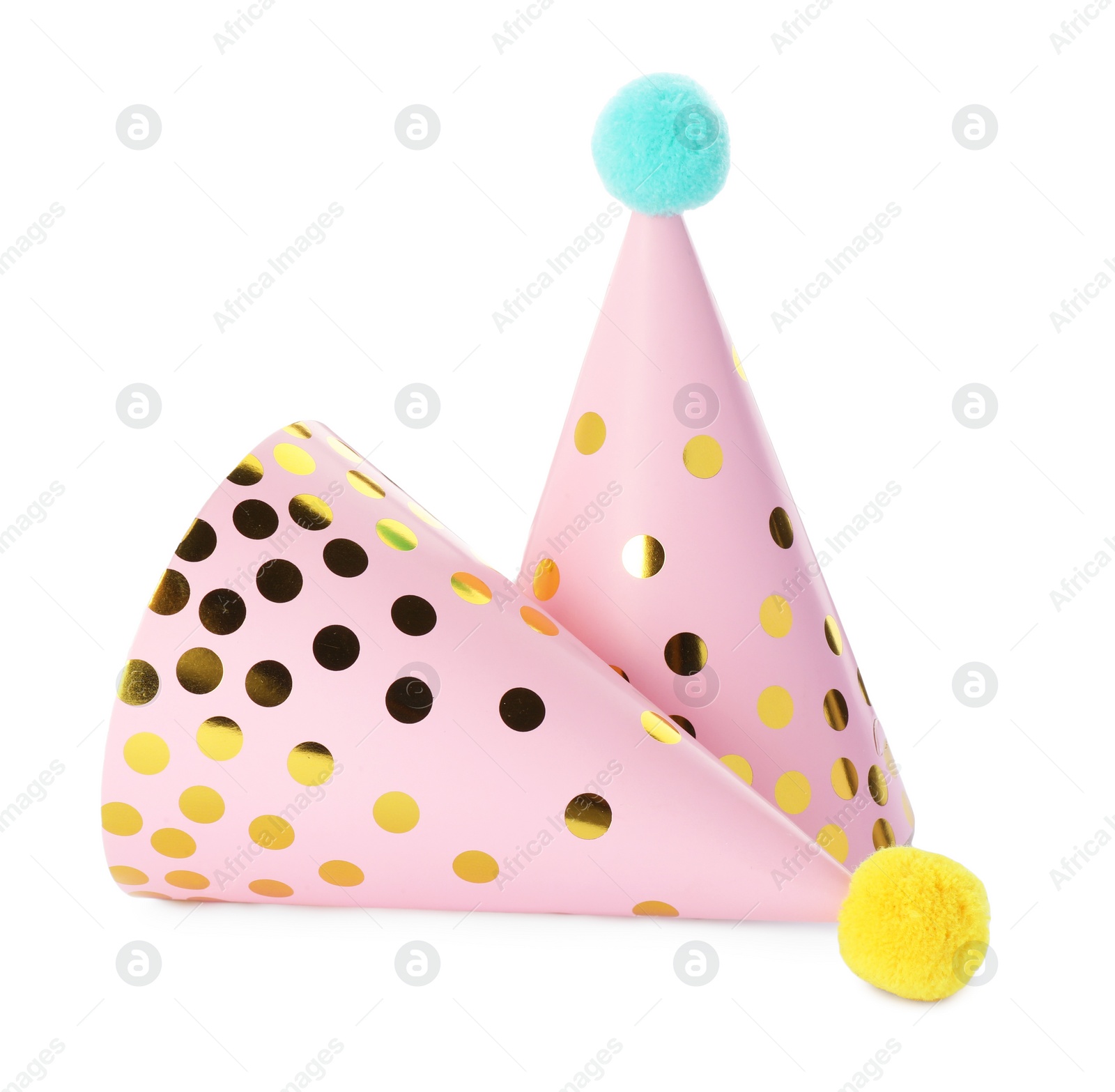 Photo of Two pink party hats with pompoms isolated on white