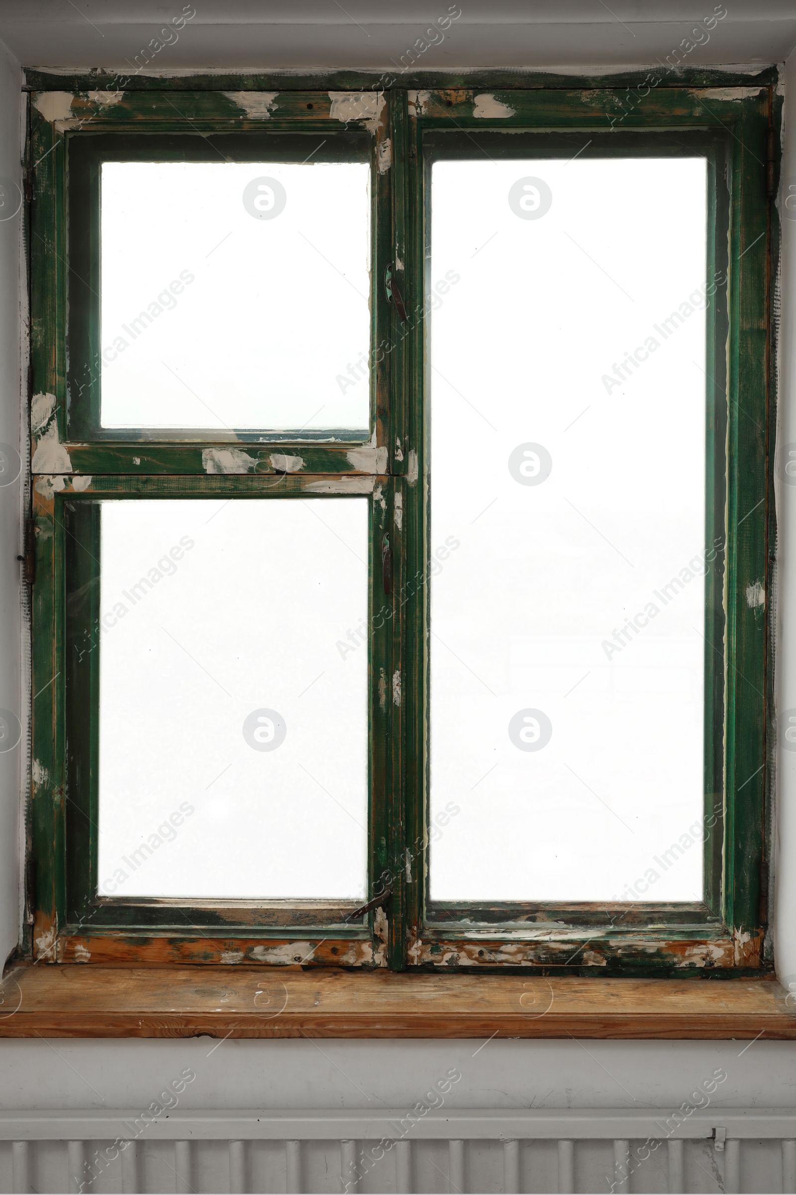 Photo of Old window with empty wooden sill in room