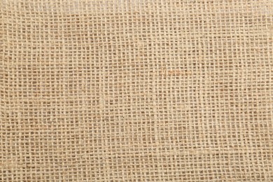 Photo of Texture of burlap fabric as background, top view