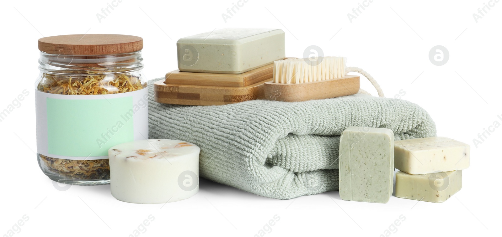 Photo of Spa composition. Towel, personal care products, brush and dry flowers on white background