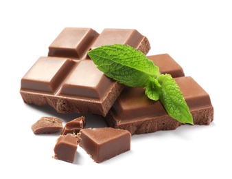 Photo of Pieces of milk chocolate with mint on white background