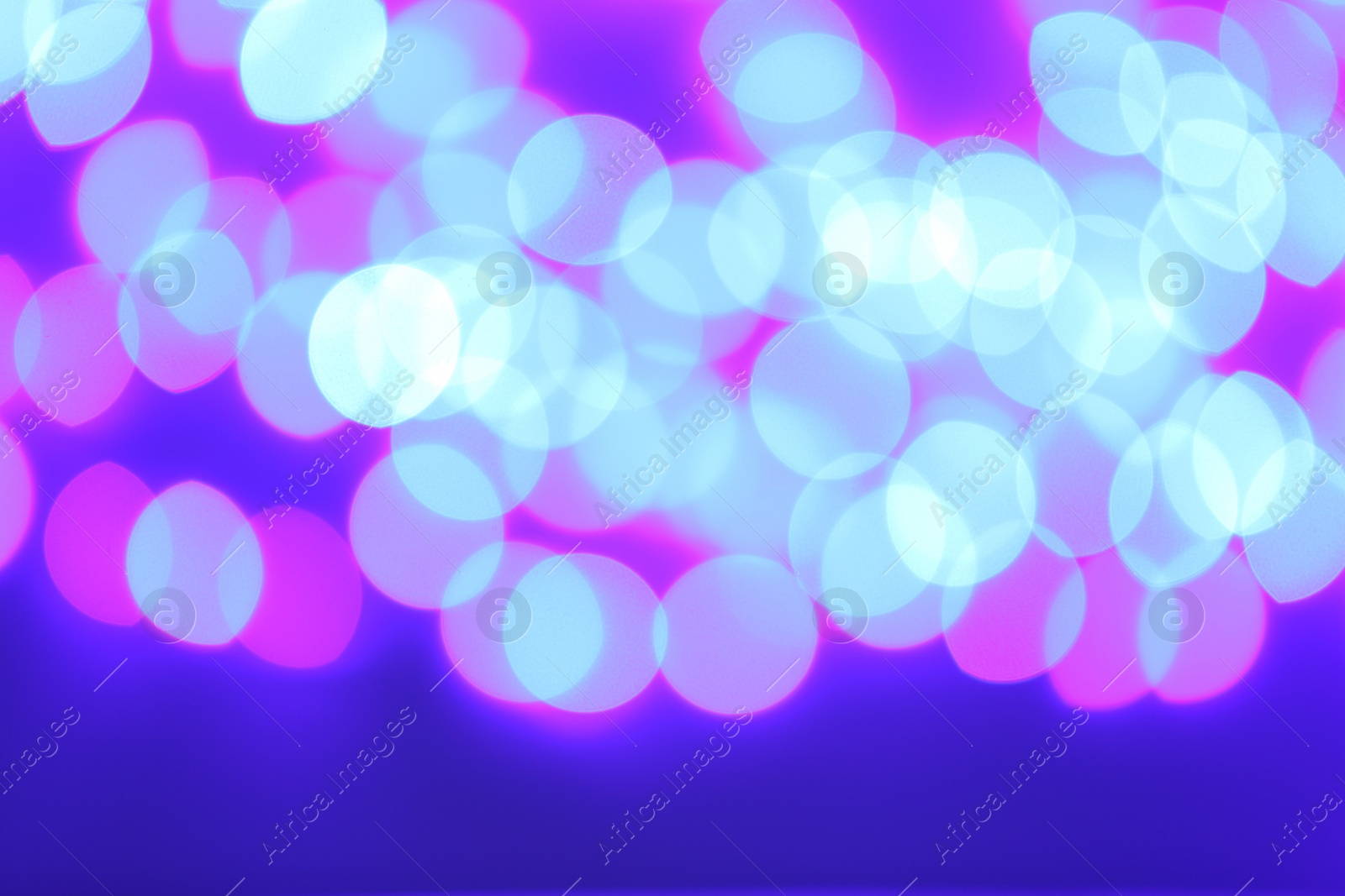 Photo of Beautiful glowing lights as background. Bokeh effect