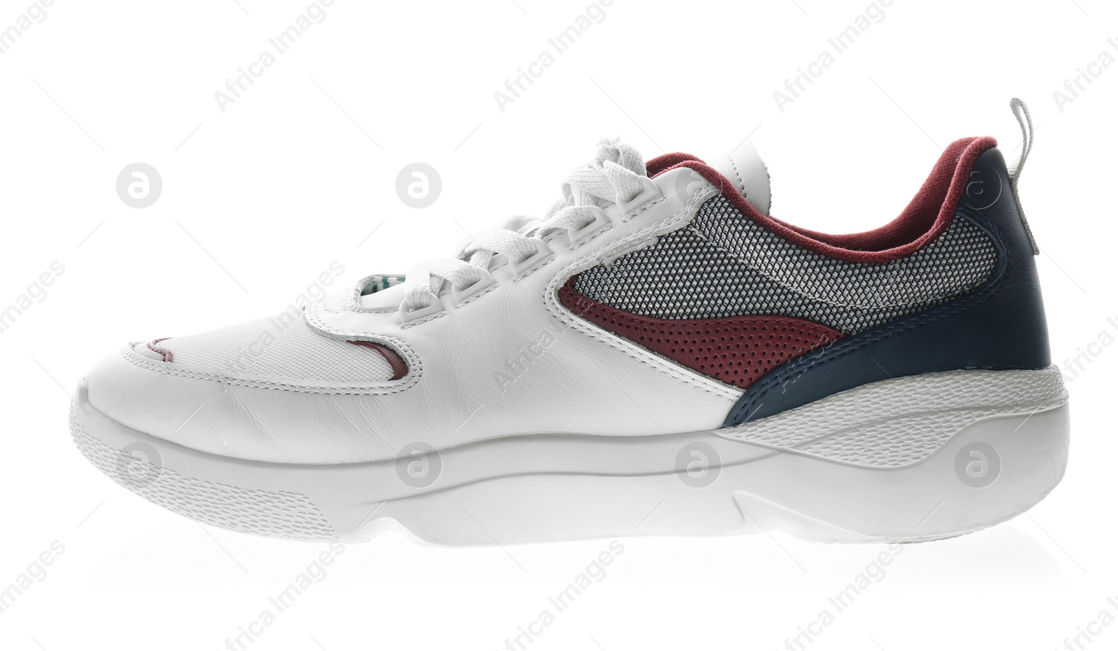 Photo of New sneaker isolated on white. Sport shoe