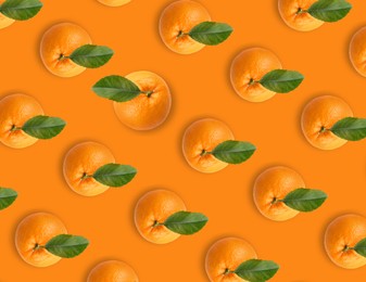 Image of Tasty fresh ripe oranges with green leaves on orange background, flat lay