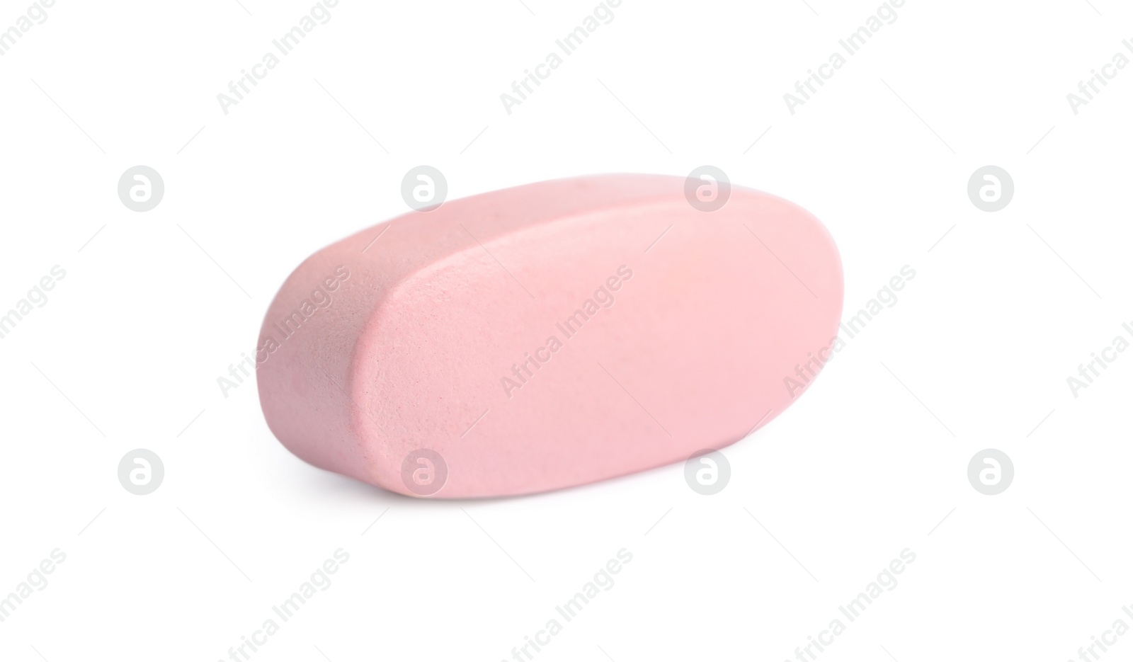 Photo of One pink pill on white background. Medicinal treatment