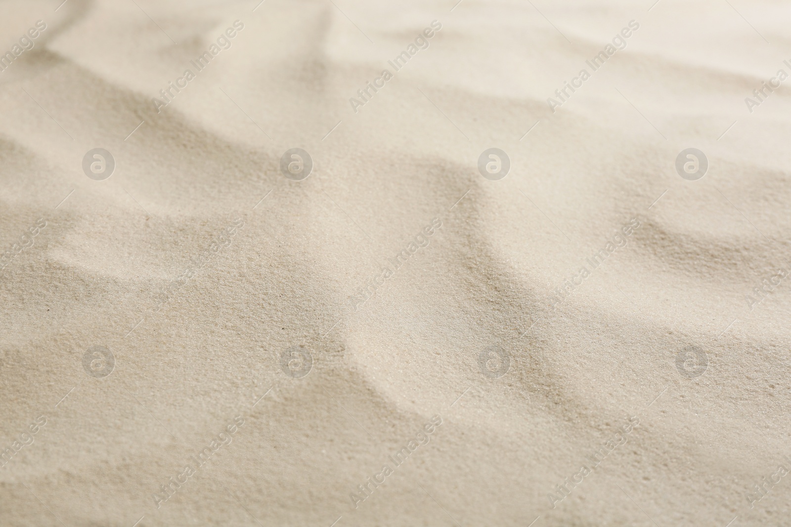 Photo of Dry beach sand as background, closeup view