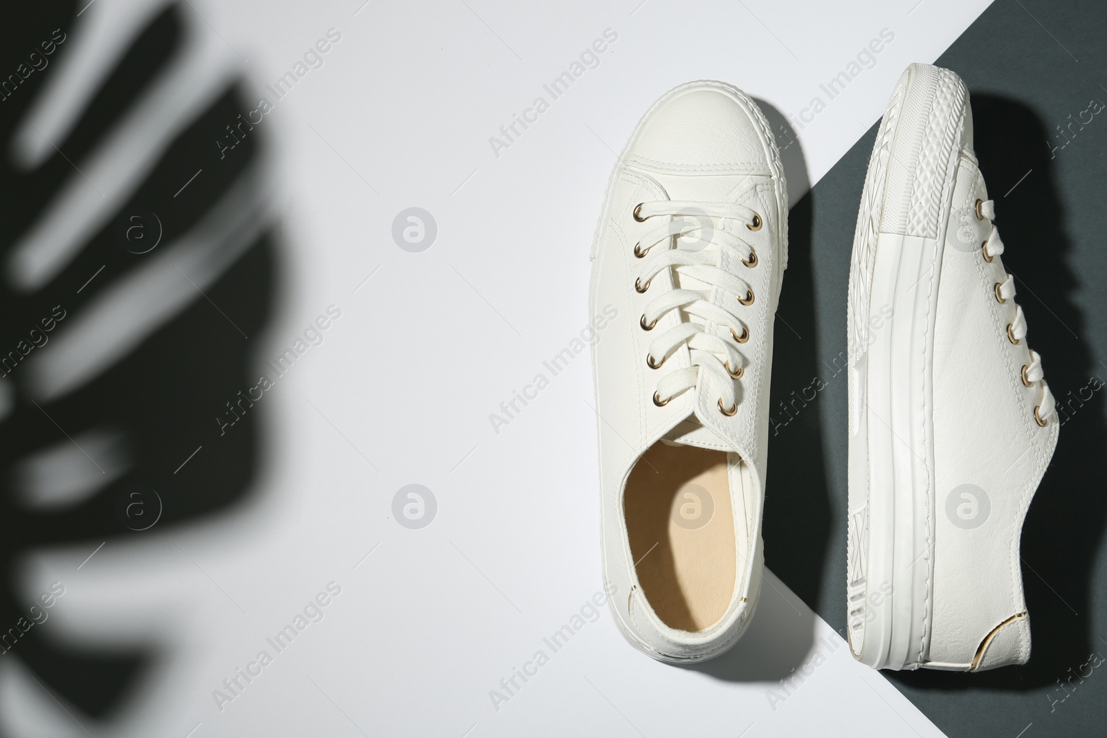 Photo of Pair of stylish shoes on color background, top view. Space for text