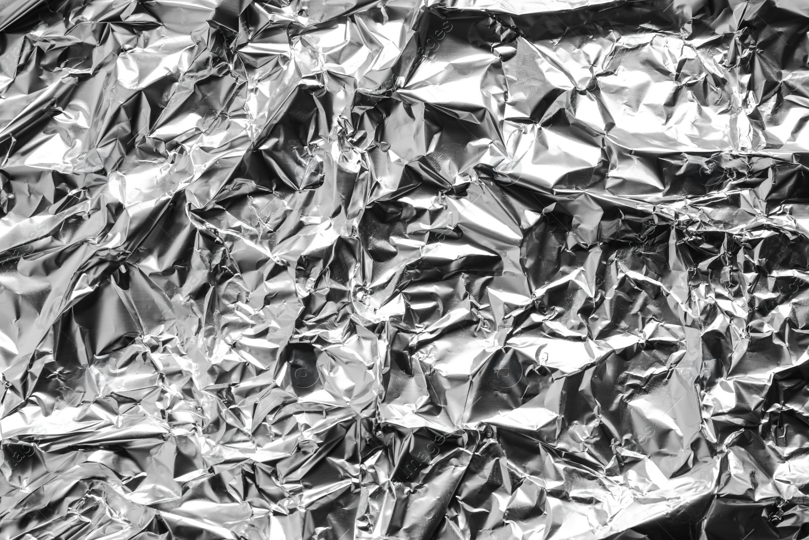 Image of Crumpled silver foil as background, top view