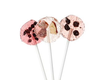 Photo of Sweet colorful lollipops with berries on white background