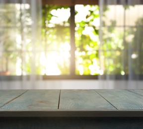 Image of Empty light blue wooden surface in room. Mockup for design