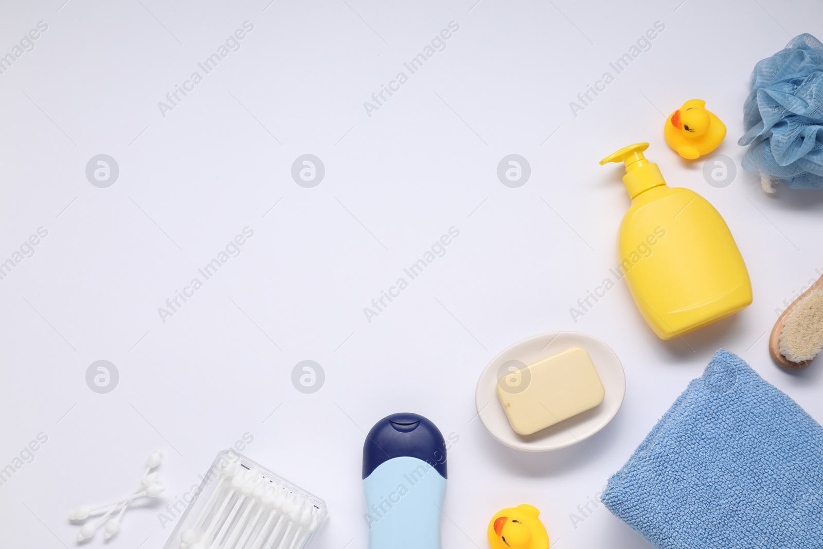 Photo of Different baby bath accessories and cosmetic products on white background, flat lay. Space for text