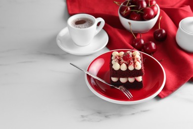 Photo of Piece of delicious red velvet cake served on white marble table, space for text