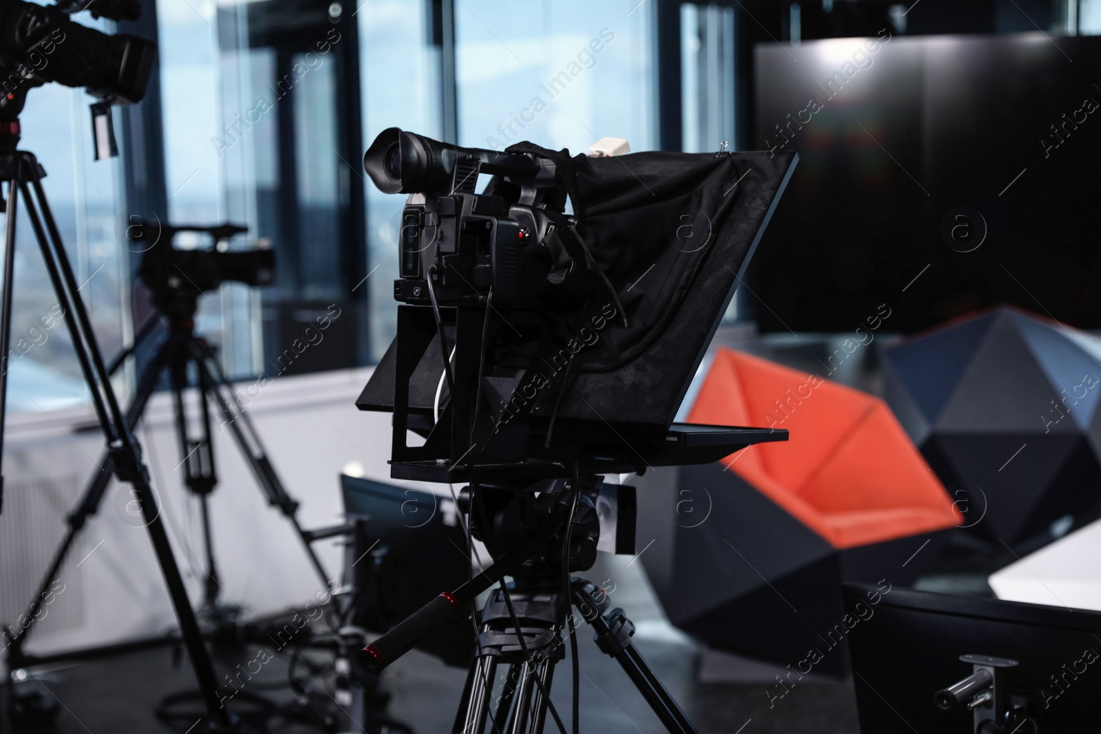 Photo of Modern video recording studio with professional equipment, focus on camera