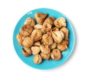 Plate with dried figs on white background, top view. Healthy fruit