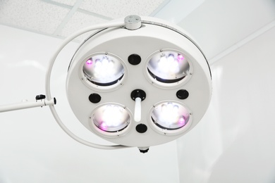 Photo of Powerful surgical lamps in modern operating room