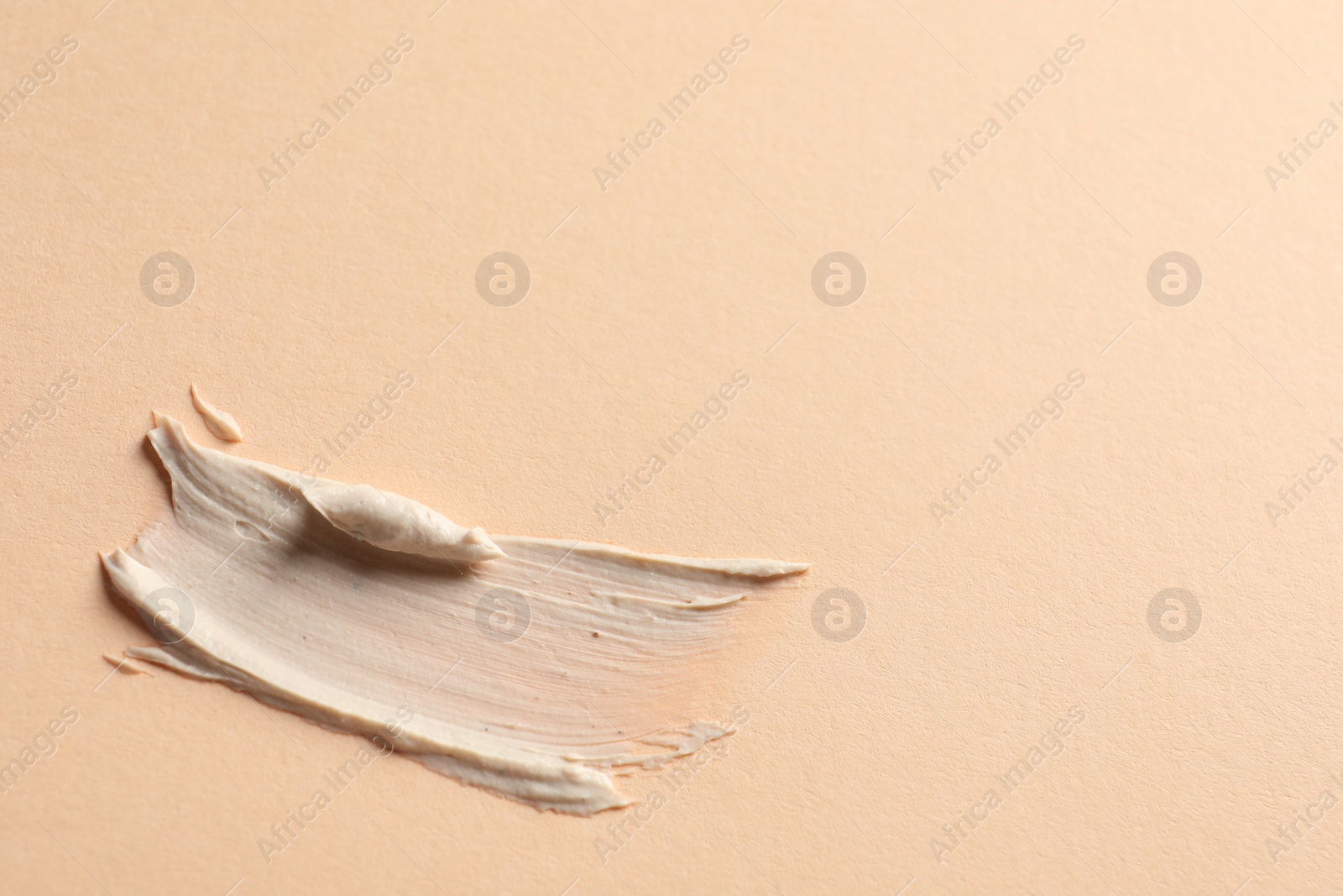 Photo of Sample of face mask on beige background, top view. Space for text