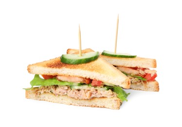 Delicious sandwiches with tuna and vegetables on white background