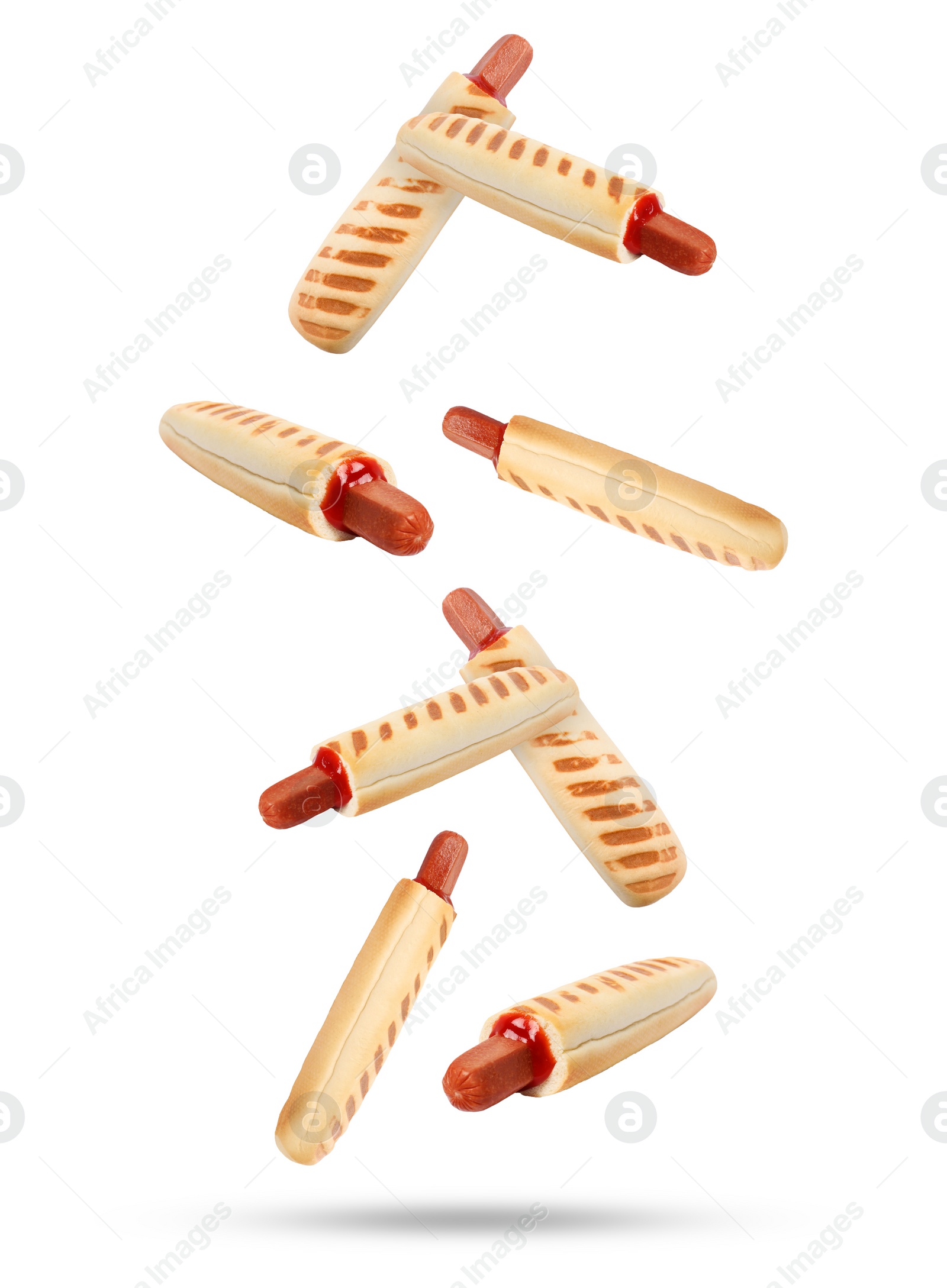 Image of Yummy French hot dogs with grilled buns falling on white background