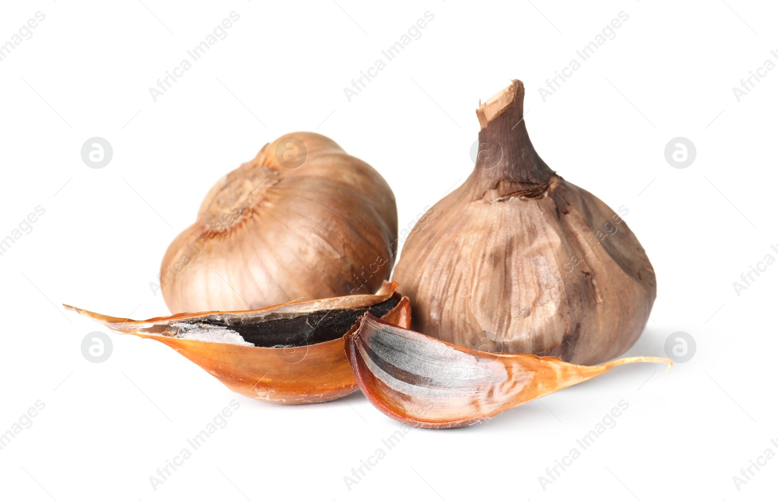 Photo of Aged black garlic on white background. Asian cuisine