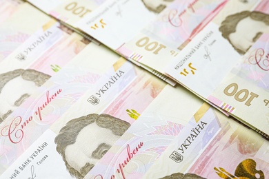Photo of Closeup view of Ukrainian money as background. National currency