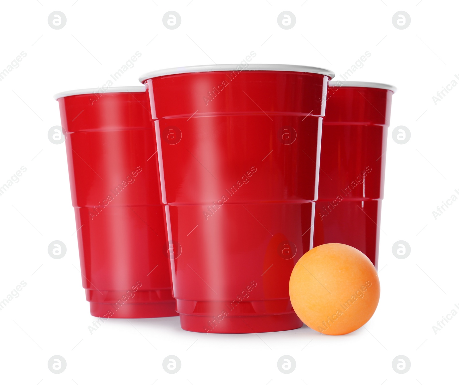 Photo of Red plastic cups and ball for beer pong on white background